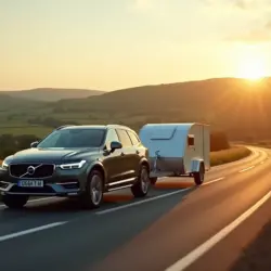Car towing a small trailer through the British countryside